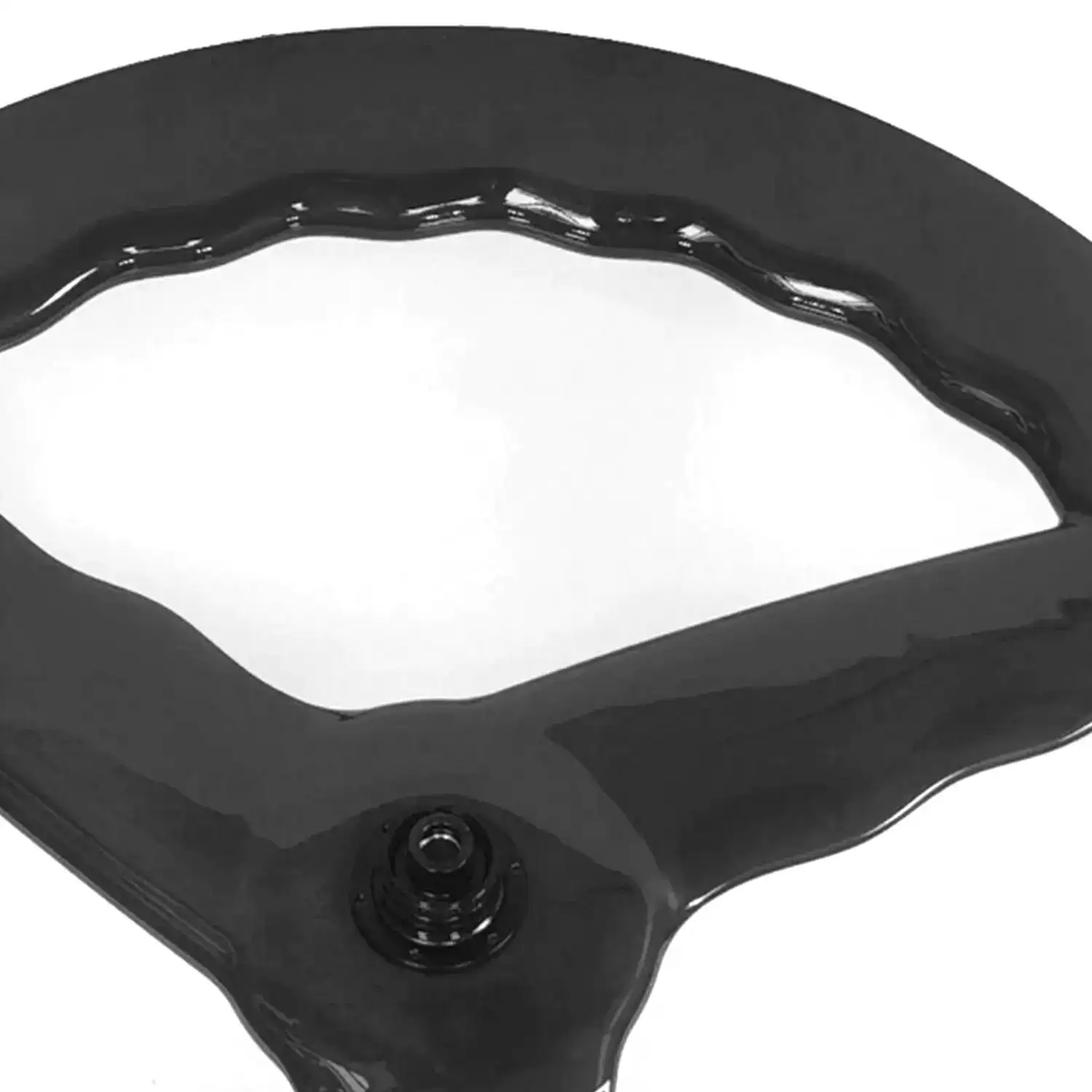 Closeup of wave-profile triaxial carbon rim on 3-spoke 700c wheelset, tubeless valve installed