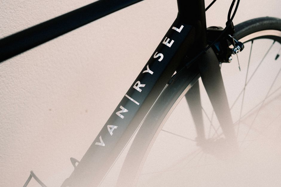 Detailed shot of a Van Rysel road bike frame showcasing its sleek design.