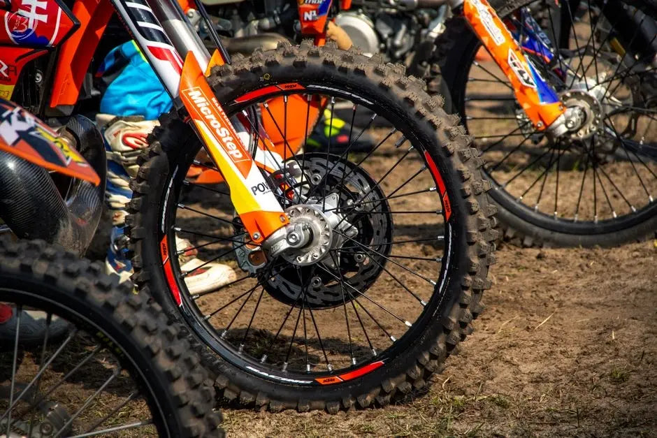 Detailed view of a motocross bike wheel on dirt, captured outdoors in Slovakia.
