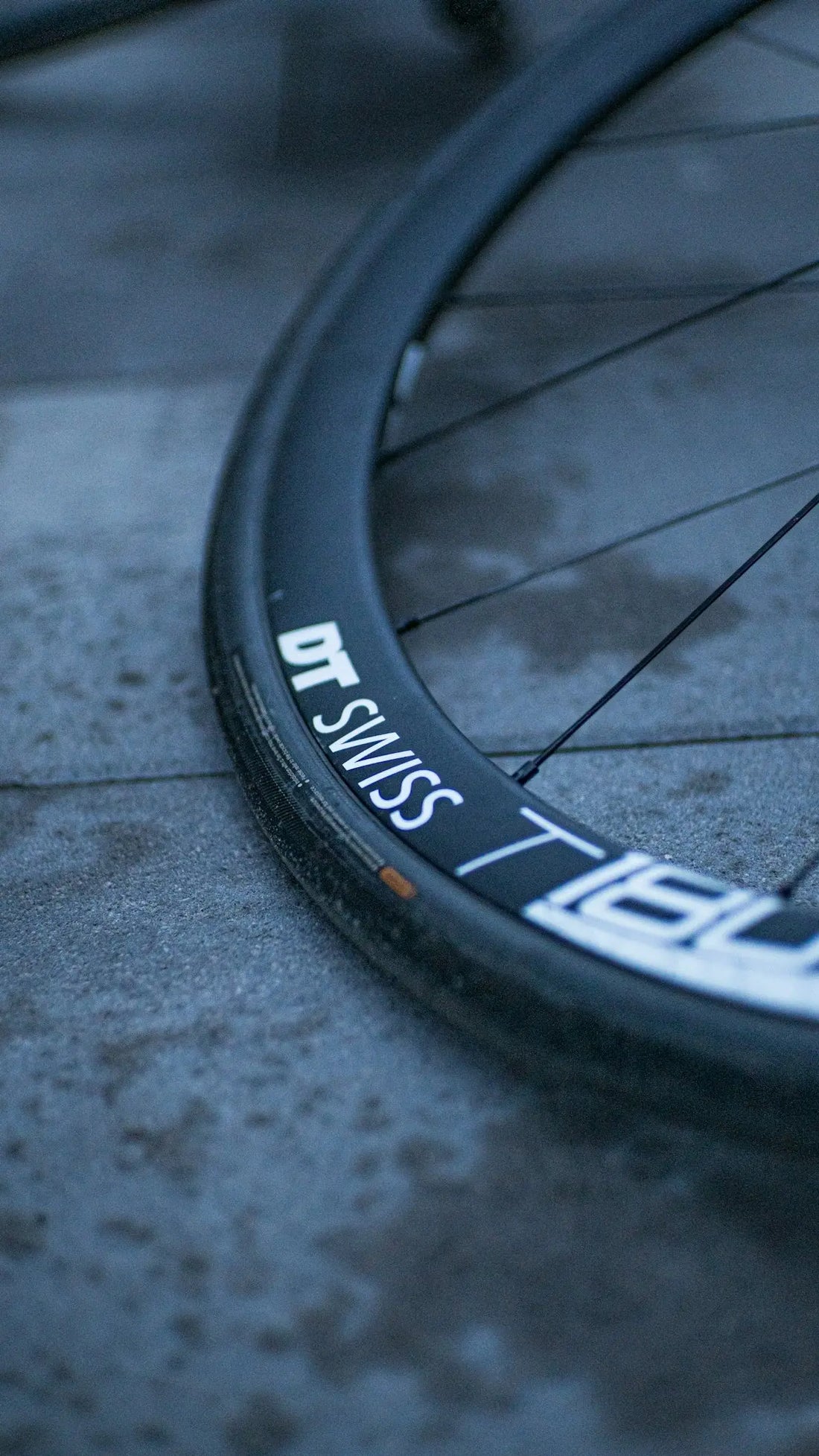 a close up of a bike tire on the ground