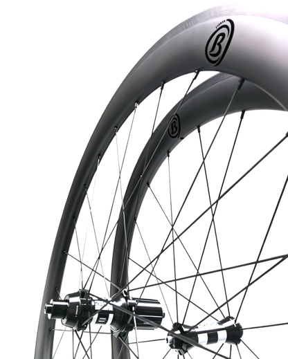 700C 38mm carbon rim brake wheelset with DT350 hubs, 25mm wide, featuring a sleek design and tubeless-ready capability.